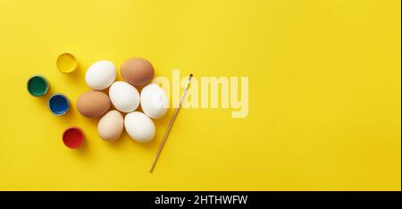 Chicken eggs and paints Stock Photo