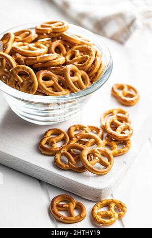 Mini pretzels. Crusty salted snack in a bowl. Stock Photo
