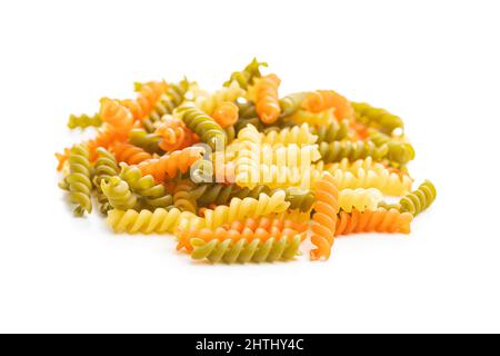 Three colors fusilli pasta. Colorful italian raw pasta isolated on white background. Stock Photo