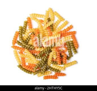 Three colors fusilli pasta. Colorful italian raw pasta isolated on white background. Stock Photo