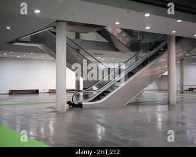 Escalators in the underground floor of a car park Stock Photo