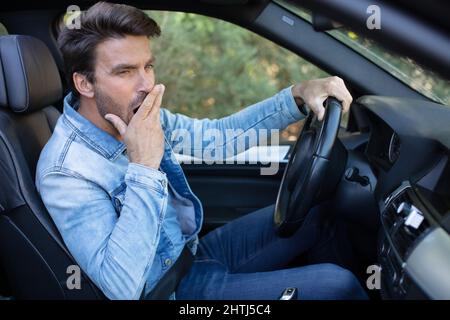 a bored man in the car stuck in the traffic Stock Photo
