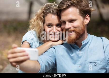 happy hipster couple taking a selfie Stock Photo