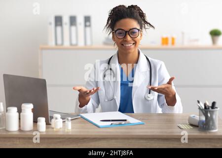 Portrait of black female medical practitioner talking to camera Stock Photo