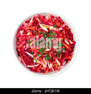Dietary, vegetable salad with cabbage, beets and carrots is isolated on a white background. Top view. Stock Photo