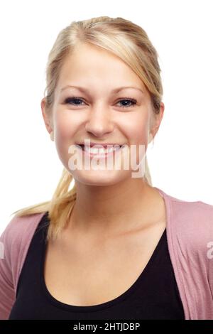Young and confident. Studio portrait of a beautiful young smiling woman isolated on white. Stock Photo