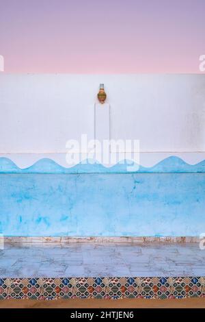 Colorful painted white wall with creative blue pattern and decoration on typical house located on street in city of Egypt Stock Photo