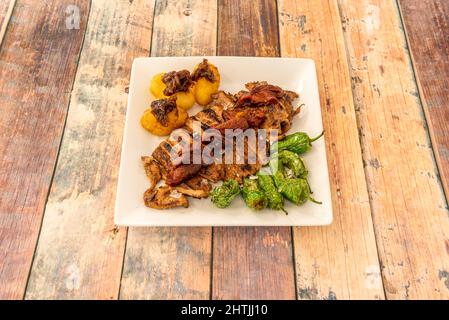 Tender and juicy secret of Iberian pork cooked at low temperature. Grilled, leaving it crispy on both sides, it will delight diners Stock Photo