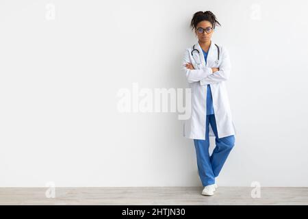 Portrait of black doctor posing with folded arms Stock Photo