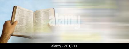 Close up view of hand holding a holy bible with copy space Stock Photo