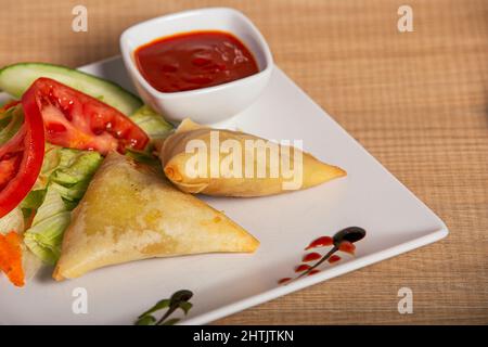 vegetable samosa served with sauces Ramadan Indian food, Pakistani food Stock Photo