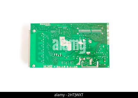Back side of main Electronic circuit green board isolated in clipping path. Stock Photo
