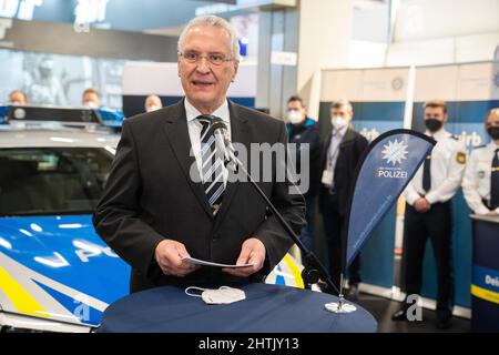 Nuremberg, Germany. 01st Mar, 2022. Bavarian Interior Minister Joachim Herrmann (CSU) speaks at the Bavarian police booth at the 'Enforce Tac' trade show. The Bavarian police will also have a booth at the two-day trade show, where they will present a high-tech patrol car and recruit new recruits. Credit: Nicolas Armer/dpa/Alamy Live News Stock Photo