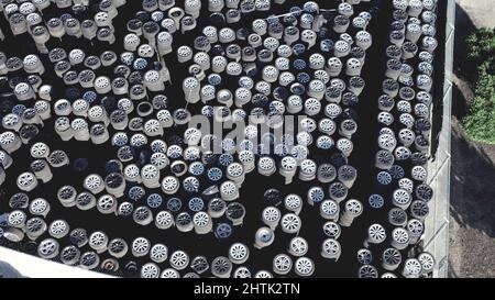 used alloy wheels rims with tires from top view background. Stock Photo