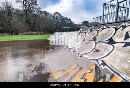 Waterlogged skatepark and recreational grounds, no children due to weather. Stock Photo