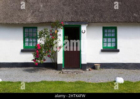 Traditional thatched cottage used as holiday lets, Ballyvaughan, The Burren, County Clare, Ireland Stock Photo