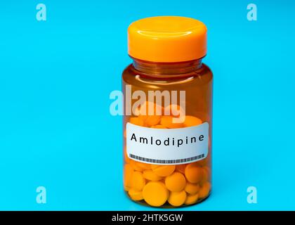 Medical vial with Amlodipine pills. Medical pills in orange Plastic Prescription Stock Photo