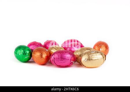 Mini chocolate Easter eggs wrapped in color foil isolated on a white background Stock Photo