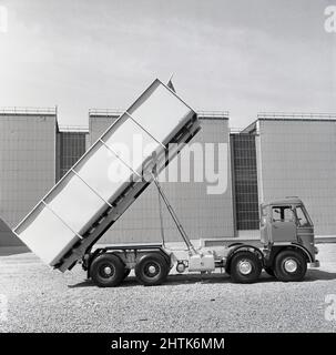 1960s, historical, a new heavy load tipper lorry or truck showing its lift for tipping, parked outside at the Abbey Works steel plant, Port Talbot, Glamorgan, Wales. UK. Stock Photo