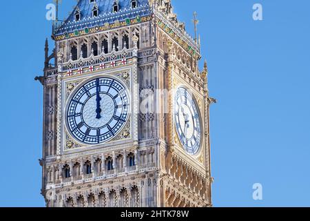 At the Houses of Parliament, London, the iconic Big Ben clock, after refurbishment, shows 12 o'clock midday on 23 feb 2022, the day it restarts. Stock Photo