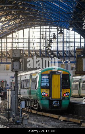 British rail class 377 train in Southern livery waiting at a platform in Brighton Railway Station, England. Stock Photo