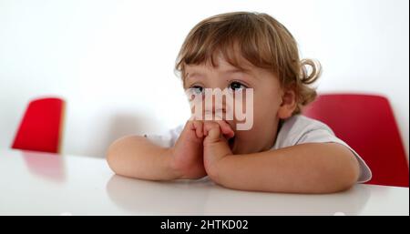 Toddler boy face close-up watching cartoon, hypnotized child by screen Stock Photo