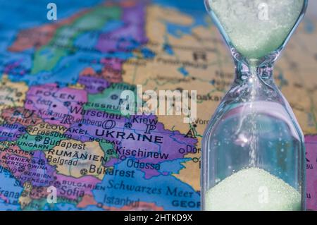 color geographic map of europe and ukraine with an hourglass in the foreground Stock Photo
