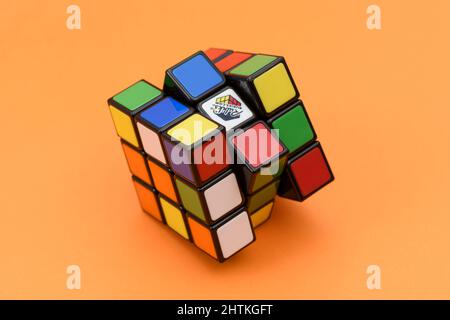ISTANBUL - TURKEY - JANUARY 30 2022: Rubik's cube on the orange background. Rubik's Cube invented by a Hungarian architect Erno Rubik in 1974. Stock Photo