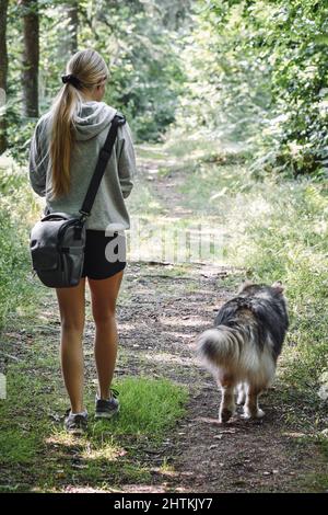 Portrait of a young Finnish Lapphund dog and girl Stock Photo