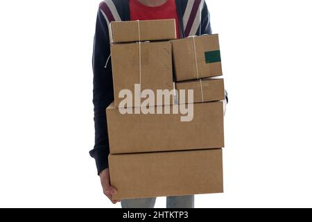 Man carrying stacked cardboard boxes or parcel box on white background Stock Photo