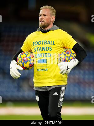 Leicester City goalkeeper Kasper Schmeichel wears a t shirt in support of the Ukraine during warm up prior to the Premier League match at Turf Moor Burnley. Picture date Tuesday March 1 2022