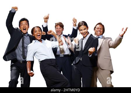 That feeling of success. Shot of a group of business people acting excited with their hands in the air on a white background. Stock Photo