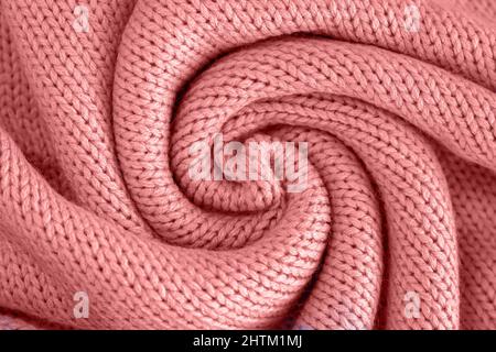 Texture of knitted woolen pink cloth. Winter sweater background Stock Photo