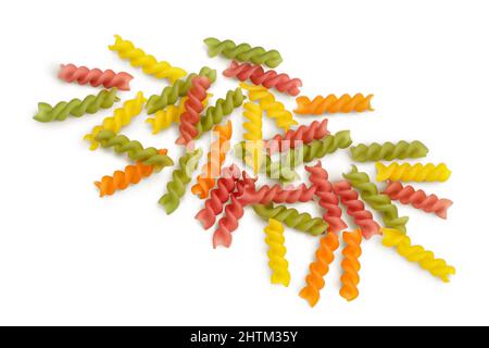 raw Fusilli colored pasta, isolated on white background with clipping path and full depth of field. Top view. Flat lay Stock Photo