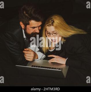 Business management. Working together on project. Two young business colleagues working on computer. Stock Photo