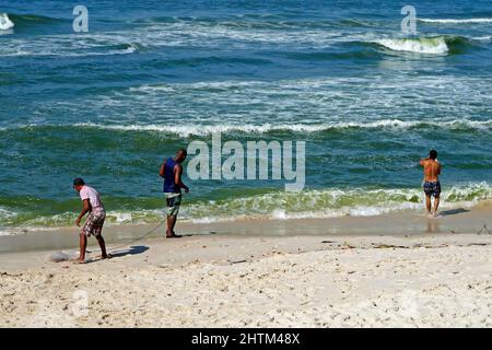 Fishermen at Barra da Tijuca beach, Rio Stock Photo