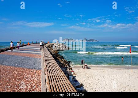 RIO DE JANEIRO, BRAZIL - MARCH 25, 2017: People in the breakwater at Barra da Tijuca beach Stock Photo