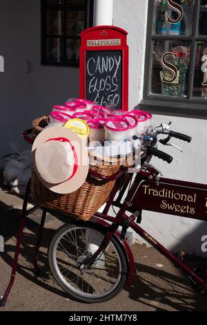 PENARTH, WALES, UK - MARCH 2014 : View of an old tradesman bicycle outside a sweet shop in Penarth, Wales on 23/03/2014 Stock Photo