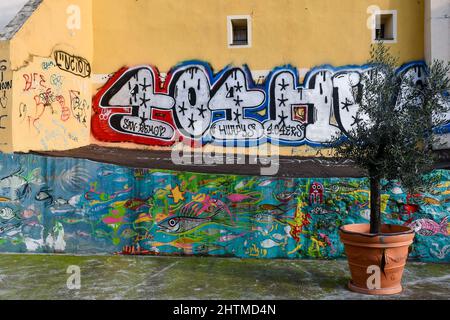 Detail of a graffiti wall in the medieval town called 'La Pigna' in Sanremo, Imperia, Liguria, Italy Stock Photo