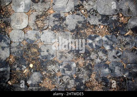 Cris-crossed design of diamond shaped street tiling. Stock Photo