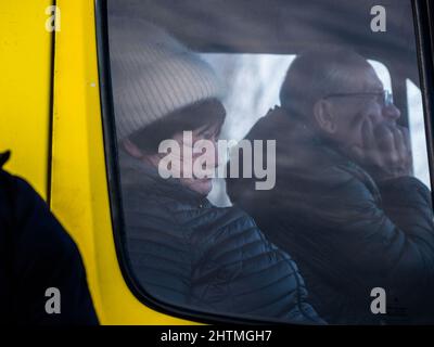 Yavoriv, Ukraine. 26th Feb, 2022. Refugees seen waiting in a vehicle as they wait to cross the border into Poland.At dawn of 24 February 2022, Russia launched a full-scale invasion to Ukraine. Civilian homes and hospitals have been destroyed by the Russian military action which caused many people to become homeless. (Credit Image: © Jana Cavojska/SOPA Images via ZUMA Press Wire) Stock Photo
