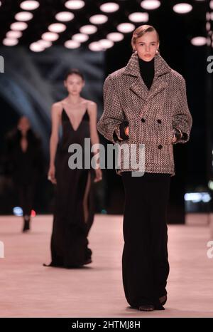 Paris, France. 01st Mar, 2022. A model takes to the catwalk during Yves Saint Laurent's Fall-Winter 2022-2023 presentation during Paris Fashion Week on Tuesday, March 1, 2022. Photo by Eco Clement/UPI Credit: UPI/Alamy Live News Stock Photo