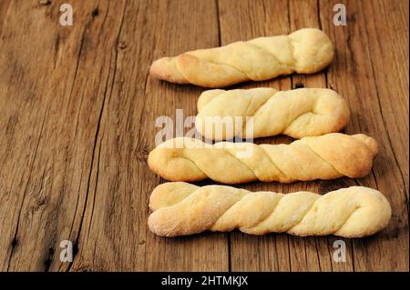 Homemade cheese twisted cookies on old wooden table copyspace Stock Photo