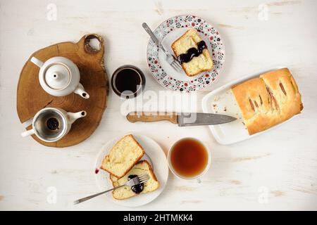 Teaware with homemade cake on white table topview overhead view Stock Photo