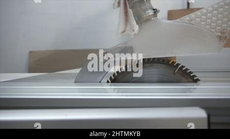 Horizontal close-up of electric saw with blade for cutting metal and aluminum. Footage. Fully automatic and programmable band saw. Stock Photo