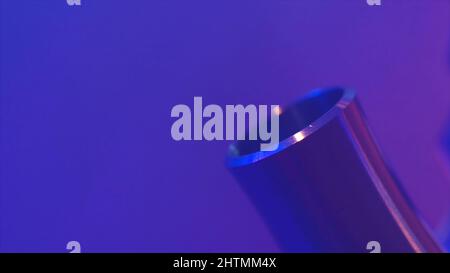 Close up of hookah metal details on black background with red and blue lights and smoke. Details of a man making hookah in smoke and neon light of nig Stock Photo