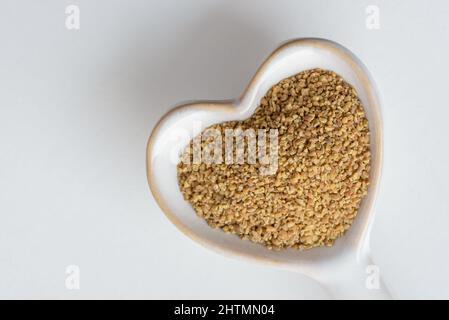 Anise Seeds on a Heart Shaped Spoon Stock Photo