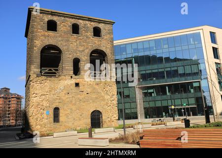 The former lifting tower, situated amonmgst the modern offices of Wellington Place, is all that remains of the old Leeds Central Railway Station. Stock Photo