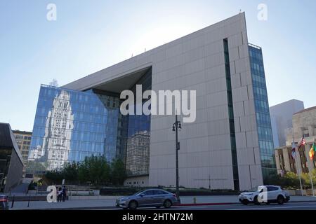 Los Angeles, CA / USA - Sept. 23, 2018: The L.A. Police Department headquarters is shown in downtown, with the City Hall building reflecting. Stock Photo