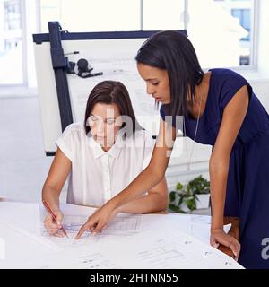 And here. Shot of a architectural colleagues working in the office. Stock Photo